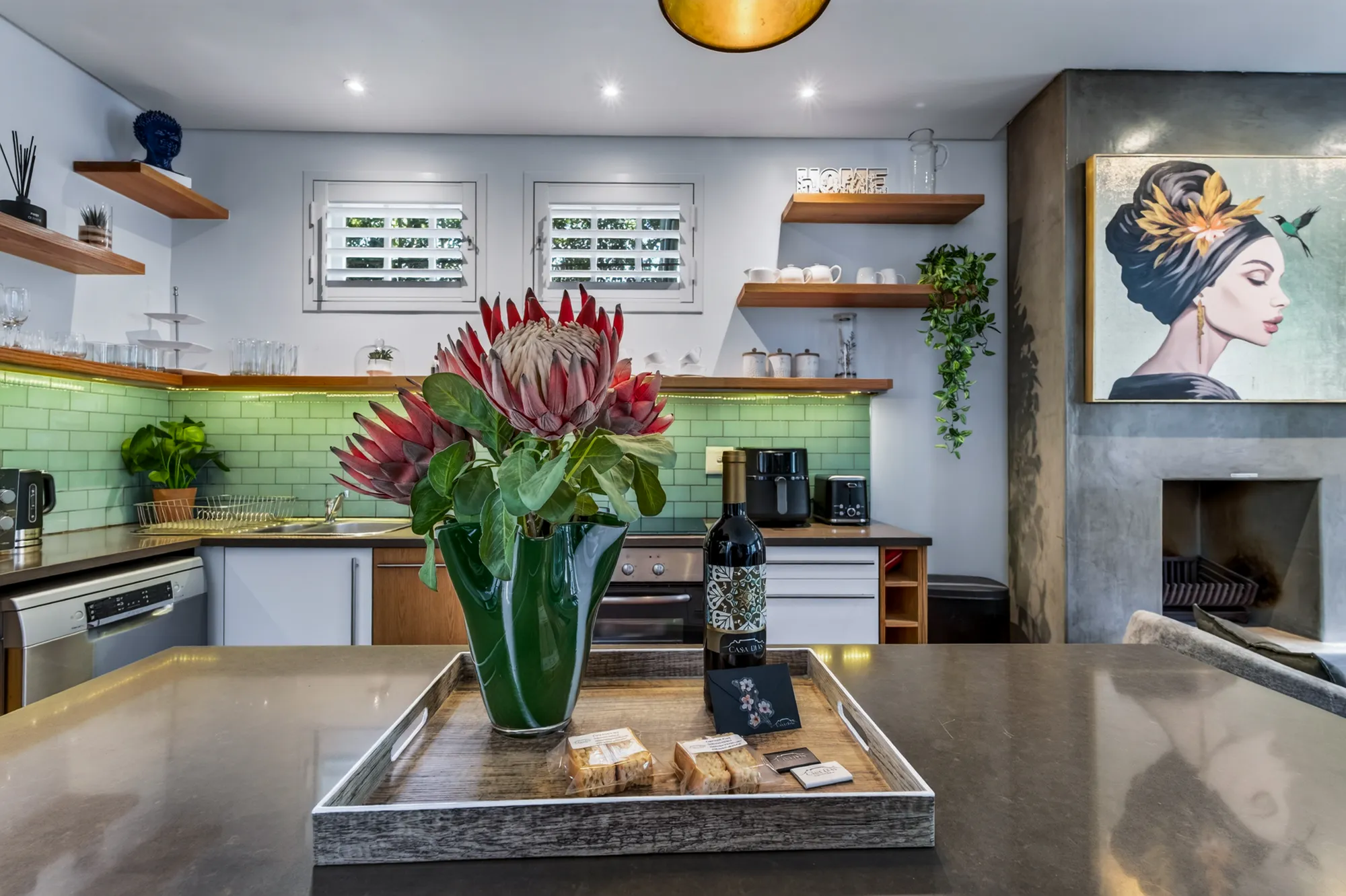 Proteas and local wine on the kitchen island at Casa Dias